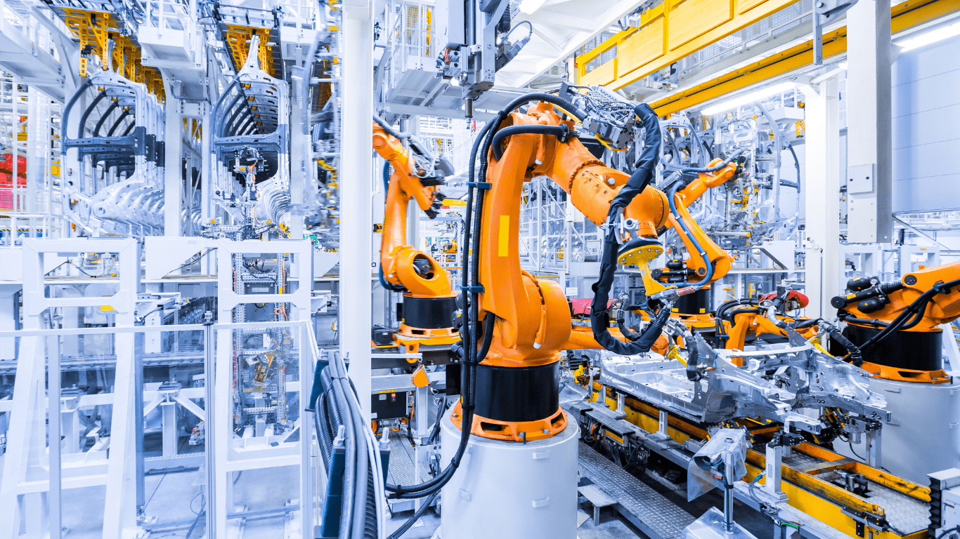 robots working in an assembly line in a factory