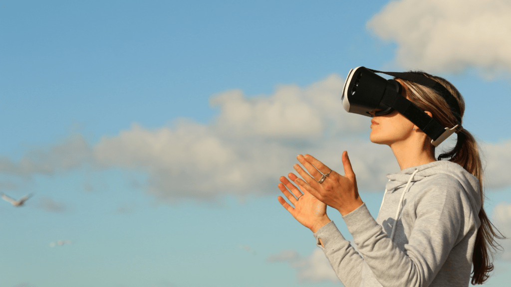 a person wearing a virtual reality headset looks up at the sky