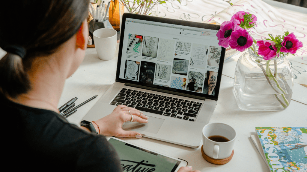 a person sits at a desk with a laptop