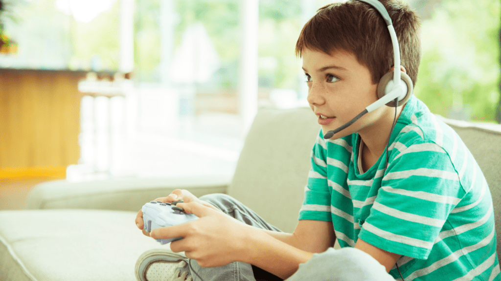 a child sitting on the floor playing video games