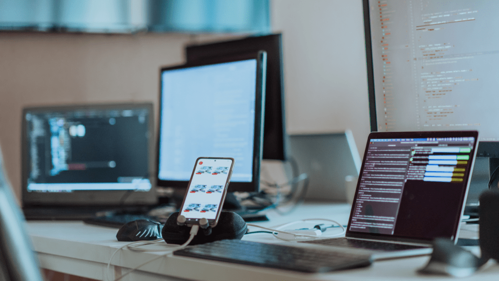 a desk with a computer, keyboard, mouse and monitor