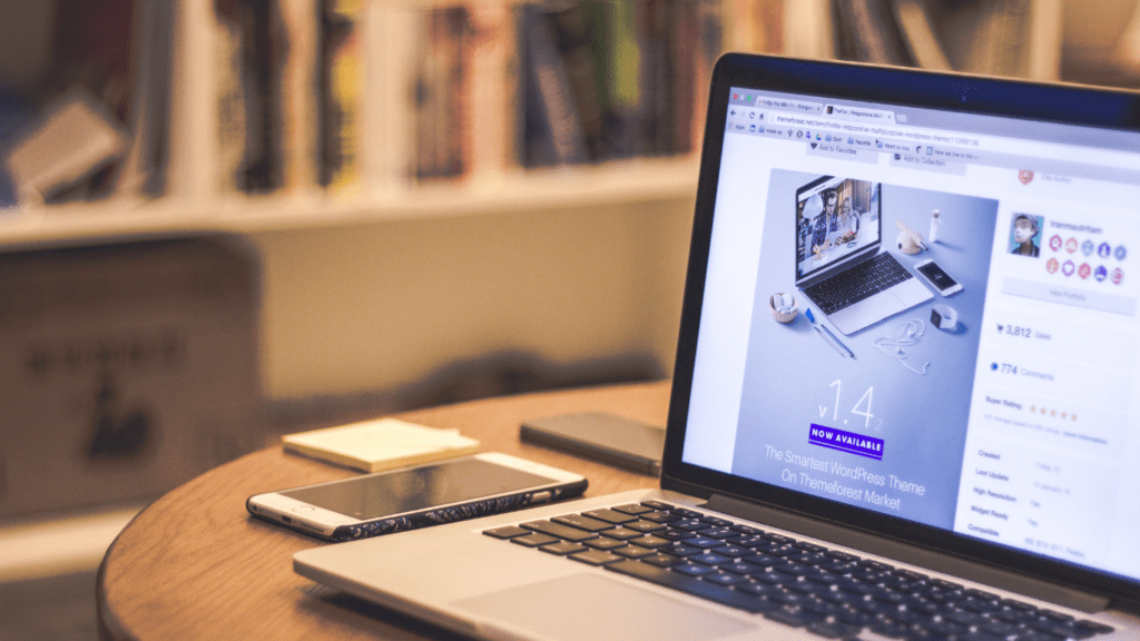 a laptop sitting on top of a white couch